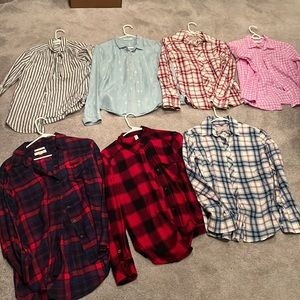 Total of seven button up shirts. Variety of brands. Size small.